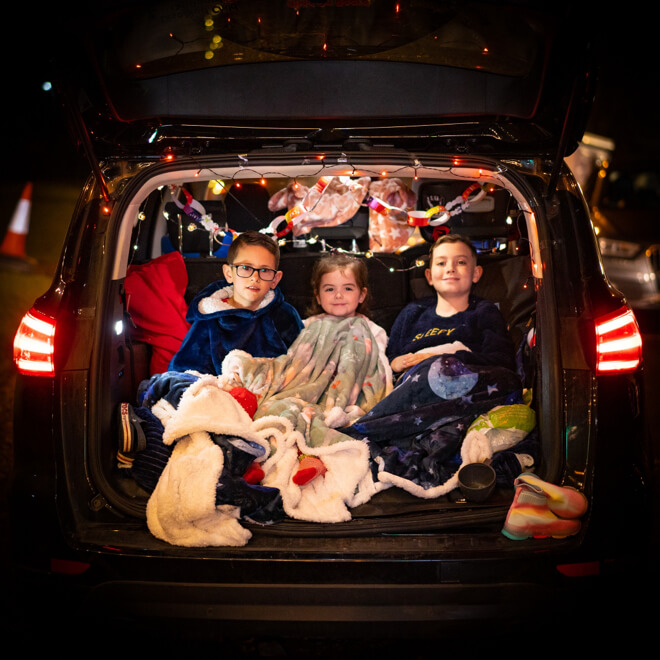 Family in the boot of their car