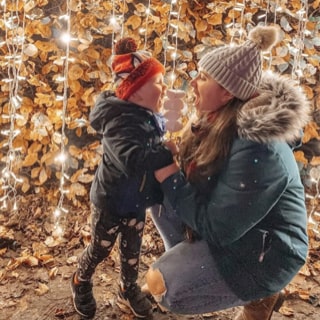 Mother and child enjoying roasted marshmallows at Marshmallowland